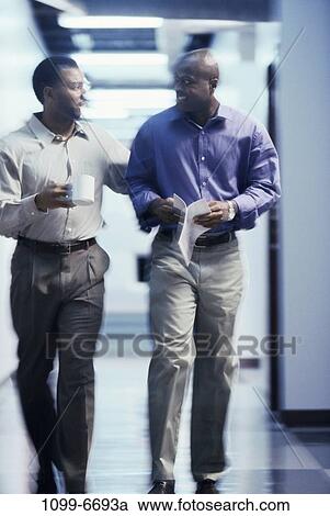 men, blur, smiling, walking, talking, papers, coffee cup View Large Photo Image Stock Image - men, blur, smiling, walking, talking, papers, coffee cup. Fotosearch