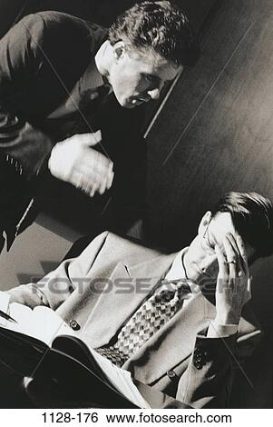 Stock Photograph - men, desk, anger, stress, business, confrontation, pain. Fotosearch