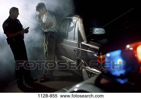 Stock Photography - men, people, night, car, policeman, outdoors, speed. Fotosearch