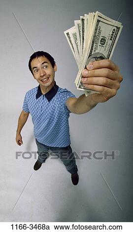 Stock Image - money, success, Asian, achievement, Middle-aged, joyous. Fotosearch