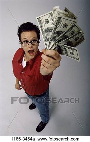 Stock Image - money, woman, success, eyeglasses, achievement, surprise, finance. Fotosearch