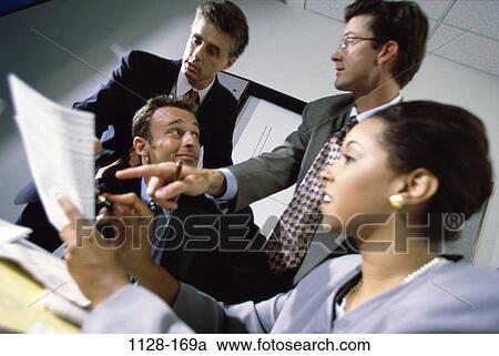 Stock Image - multiethnic, business, Middle-aged, teamwork, executives, meetings, indoors. Fotosearch