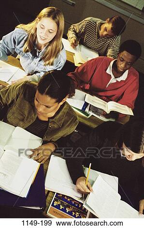multiethnic, desk, classroom, studying, writing, education, class View Large Photo Image Stock Photo - multiethnic, desk, classroom, studying, writing, education, class. Fotosearch