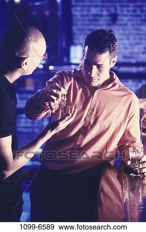 Stock Photo - multiethnic, men, bar, alcohol, drunk, indoors. Fotosearch