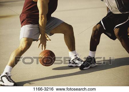 Stock Photograph - multiethnic, men, playing, ball, outdoors, sports. Fotosearch