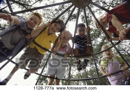Stock Image - multiethnic, overhead, people, playing, climbing, playground. Fotosearch