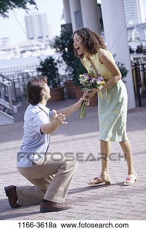 multiethnic, people, couple, flowers, outdoors, giving, give View Large Photo Image Stock Image - multiethnic, people, couple, flowers, outdoors, giving, give. Fotosearch