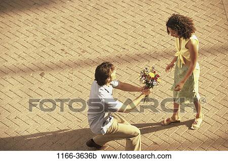multiethnic, people, couple, flowers, outdoors, gift View Large Photo Image Stock Image - multiethnic, people, couple, flowers, outdoors, gift. Fotosearch