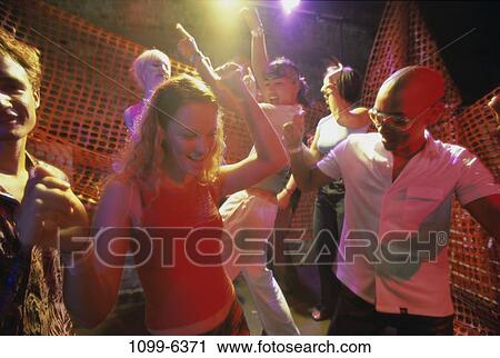 Stock Image - multiethnic, people, dancing, dance, nightlife, parties. Fotosearch
