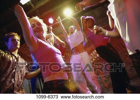 Stock Image - multiethnic, people, dancing, dance, nightlife, teens. Fotosearch