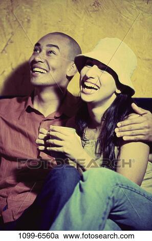 multiethnic, people, hat, couple, mug, drinking, laughing View Large Photo Image Stock Image - multiethnic, people, hat, couple, mug, drinking, laughing. Fotosearch