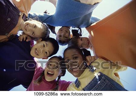 multiethnic, people, outdoors, friends, children, huddled, huddle View Large Photo Image Stock Image - multiethnic, people, outdoors, friends, children, huddled, huddle. Fotosearch