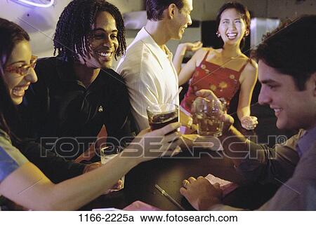 Stock Image - multiethnic, people, party, smiling, eyeglasses, toasting. Fotosearch
