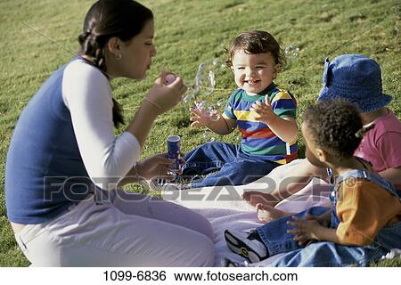 multiethnic, people, playing, bubbles, outdoors, blowing, play View Large Photo Image Stock Photograph - multiethnic, people, playing, bubbles, outdoors, blowing, play. Fotosearch