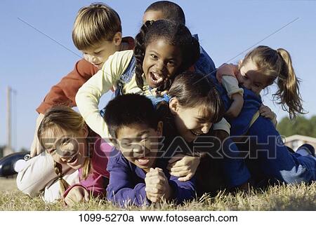 multiethnic, people, playing, ground, crushing, falling, laughing View Large Photo Image Stock Image - multiethnic, people, playing, ground, crushing, falling, laughing. Fotosearch