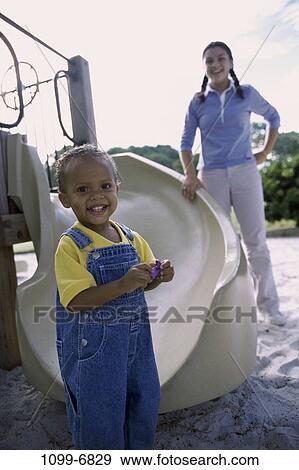 multiethnic, people, playing, sliding, playground, outdoors, play View Large Photo Image Stock Photo - multiethnic, people, playing, sliding, playground, outdoors, play. Fotosearch