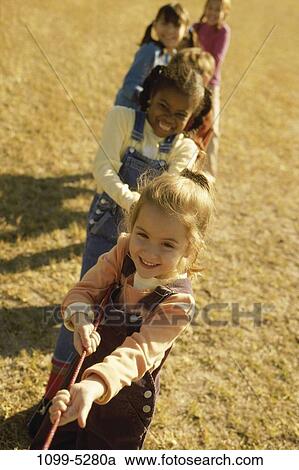 multiethnic, people, rope, outdoors, pulling, teamwork, children View Large Photo Image Stock Image - multiethnic, people, rope, outdoors, pulling, teamwork, children. Fotosearch