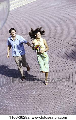 multiethnic, people, running, couple, flowers, outdoors, teens View Large Photo Image Stock Image - multiethnic, people, running, couple, flowers, outdoors, teens. Fotosearch