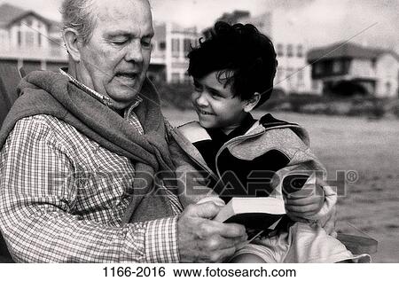 multiethnic, people, sitting, reading, beach, book, houses View Large Photo Image Stock Photograph - multiethnic, people, sitting, reading, beach, book, houses. Fotosearch