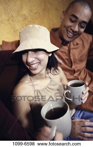 multiethnic, people, smiling, hat, couple, coffee, drinking View Large Photo Image Stock Photo - multiethnic, people, smiling, hat, couple, coffee, drinking. Fotosearch