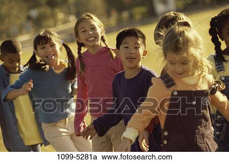 multiethnic, people, smiling, playful, outdoors, diversity View Large Photo Image Stock Image - multiethnic, people, smiling, playful, outdoors, diversity. Fotosearch