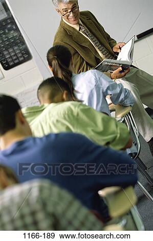 multiethnic, teacher, listening, school, classroom, education, class View Large Photo Image Stock Photo - multiethnic, teacher, listening, school, classroom, education, class. Fotosearch