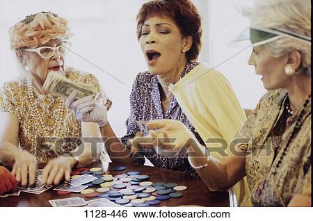 Stock Photograph - multiethnic, women, people, party, table, cigar. Fotosearch