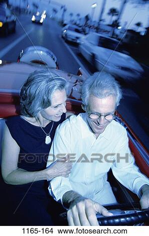 overhead, people, smiling, night, couple, eyeglasses, steer View Large Photo Image Picture - overhead, people, smiling, night, couple, eyeglasses, steer. Fotosearch