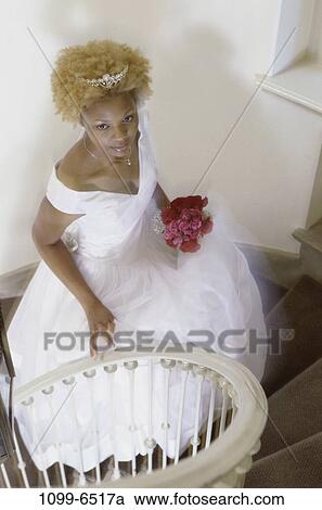 Stock Image - overhead, people, stairs, woman, walking, flowers, wedding. Fotosearch