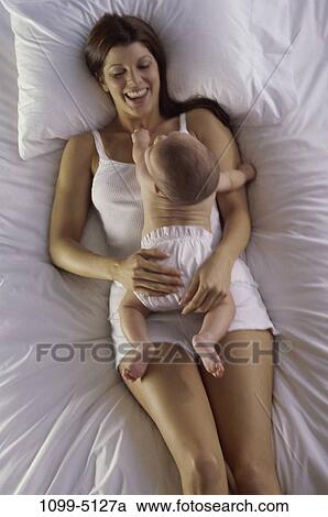overhead, white, people, pillow, mother, baby, tranquility View Large Photo Image Stock Image - overhead, white, people, pillow, mother, baby, tranquility. Fotosearch
