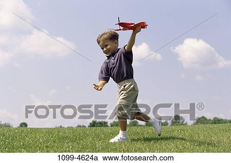 people, airplane, playing, boy, outdoors, play, hobby View Large Photo Image Stock Image - people, airplane, playing, boy, outdoors, play, hobby. Fotosearch