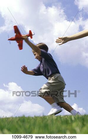 people, airplane, running, playing, boy, motion, outdoors View Large Photo Image Stock Photo - people, airplane, running, playing, boy, motion, outdoors. Fotosearch