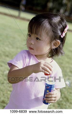 people, Asian, bottle, bubbles, girl, outdoors, blowing View Large Photo Image Stock Photo - people, Asian, bottle, bubbles, girl, outdoors, blowing. Fotosearch