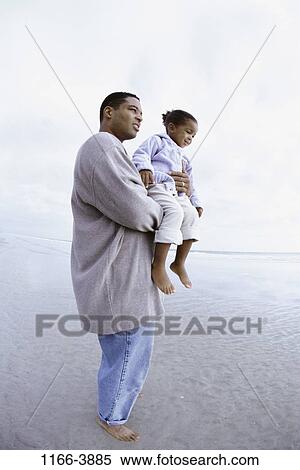 people, beach, holding, carrying, family, father, daughter View Large Photo Image Stock Photography - people, beach, holding, carrying, family, father, daughter. Fotosearch