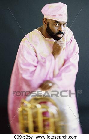 Stock Photo - people, beard, cap, mustache, serious, indoors. Fotosearch