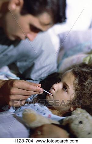Picture - people, bed, thermometer, temperature, nurturing, family, father. Fotosearch