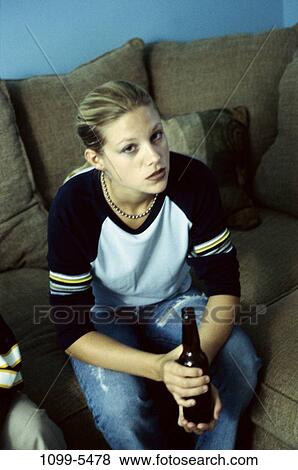 Stock Photo - people, beer, drinking, alcohol, blond, alcohol abuse. Fotosearch