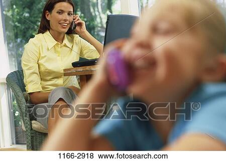 Stock Photo - people, blur, woman, telephone, talking, mother, computer. Fotosearch
