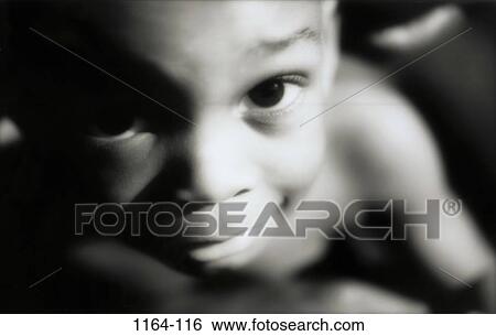 Stock Photograph - people, boy, child, black and white, indoors, monochromatic. Fotosearch