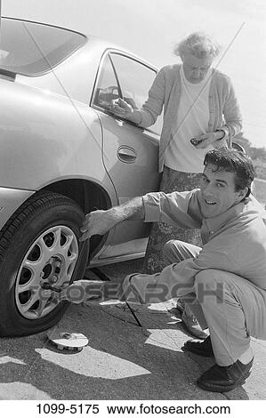 people, car, tire, helping, flat, breakdowns, repair View Large Photo Image Stock Photography - people, car, tire, helping, flat, breakdowns, repair. Fotosearch