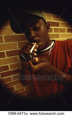 Stock Image - people, cigarette, outdoors, smoking, vice, addiction. Fotosearch