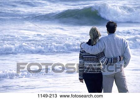 people, couple, beach, cold, waves, Middle-aged, sweaters View Large Photo Image Stock Image - people, couple, beach, cold, waves, Middle-aged, sweaters. Fotosearch
