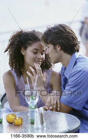 Stock Image - people, couple, drinking, dining, young adult, Young couples dining. Fotosearch