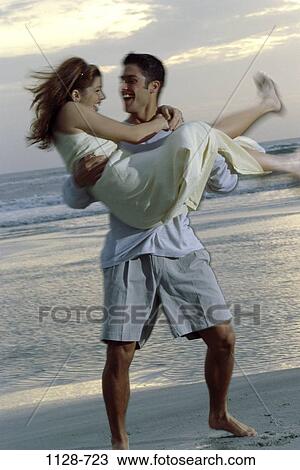 people, couple, Hispanic, beach, holding, outdoors, carrying View Large Photo Image Stock Image - people, couple, Hispanic, beach, holding, outdoors, carrying. Fotosearch