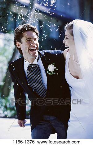 people, couple, laughing, outdoors, commitment, confetti, beginnings View Large Photo Image Stock Photograph - people, couple, laughing, outdoors, commitment, confetti, beginnings. Fotosearch