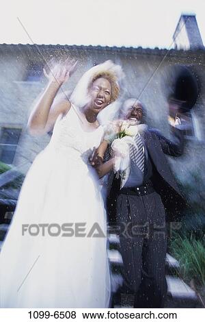 people, couple, motion, outdoors, waving, commitment, confetti View Large Photo Image Stock Photo - people, couple, motion, outdoors, waving, commitment, confetti. Fotosearch