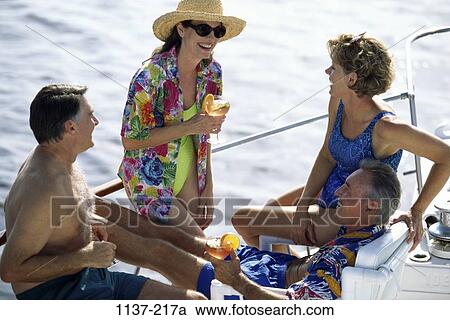 people, couple, ocean, outdoors, friends, fun, Caucasian View Large Photo Image Stock Image - people, couple, ocean, outdoors, friends, fun, Caucasian. Fotosearch