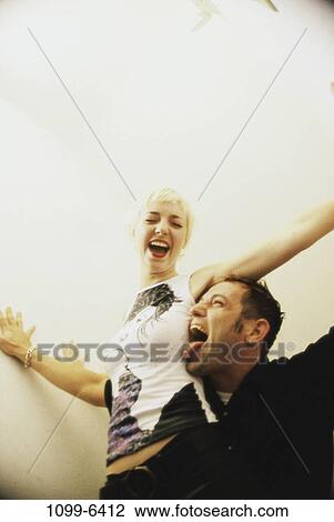 people, couple, piercing, indoors, Caucasian, Pierce View Large Photo Image Stock Image - people, couple, piercing, indoors, Caucasian, Pierce. Fotosearch