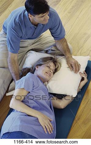 Picture - people, couple, pillow, leaning, nurturing, Middle-aged, relaxing. Fotosearch