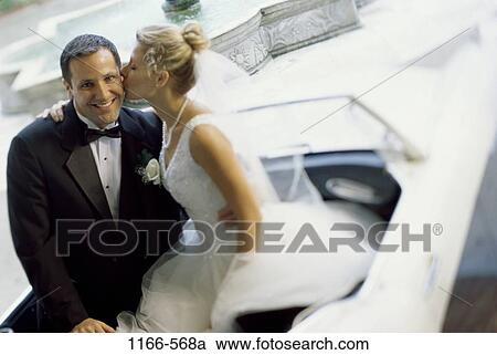 Stock Image - people, couple, sitting, car, convertible, departure, outdoors. Fotosearch